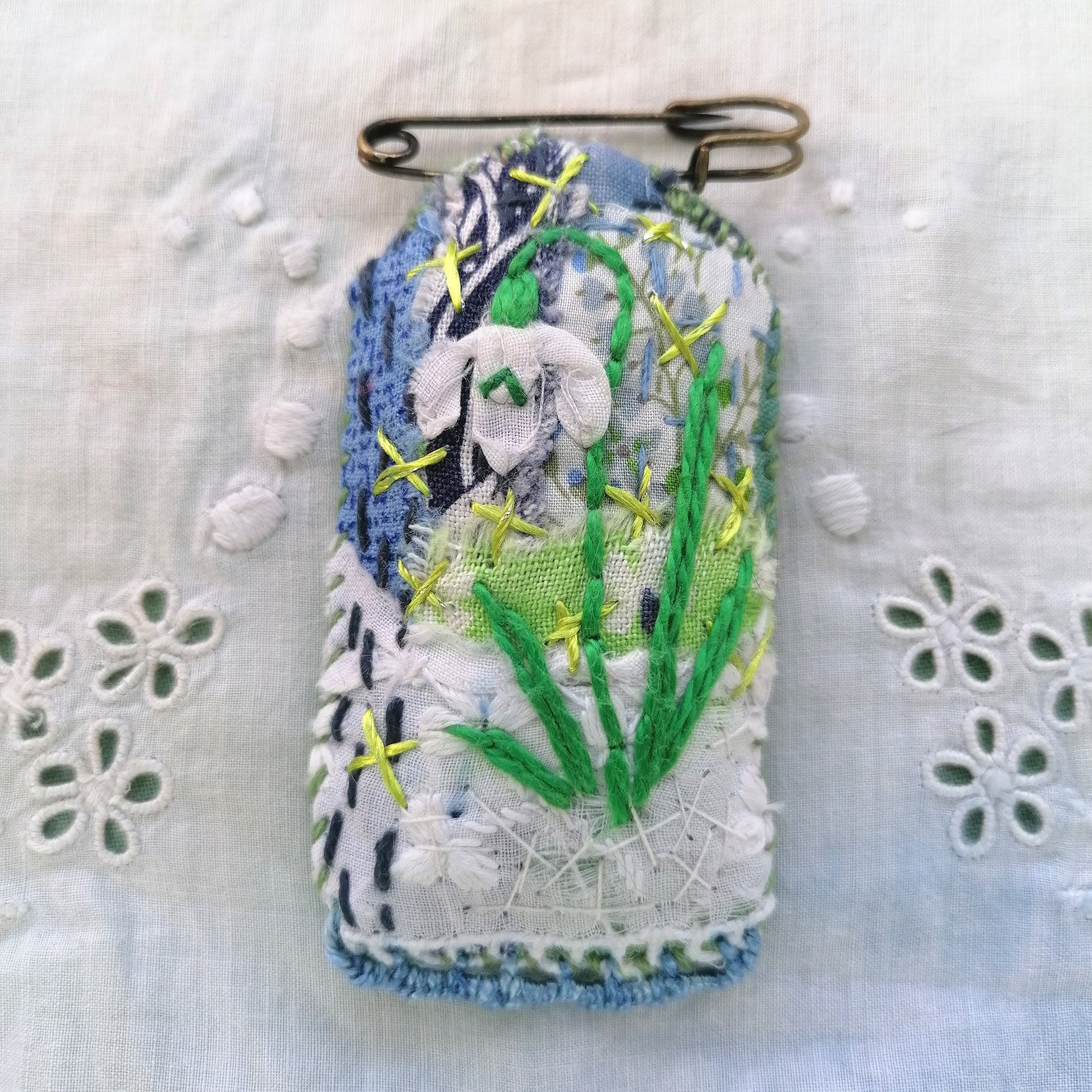 Tag shaped, padded and embroidered snowdrop brooch 1 on vintage style bronze tone kilt pin